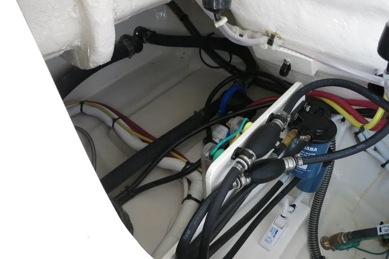 Slide: The Image of 2025 Robalo R250 Center Console boat wiring and engine components. - 28