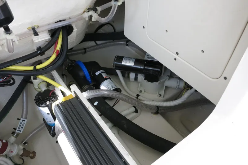 Slide: The Image of 2025 Robalo R250 Center Console boat interior wiring and plumbing system. - 29