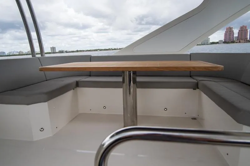 Slide: The Image of Luxurious seating area on 2023 Absolute 62 Fly yacht with ocean view. - 22