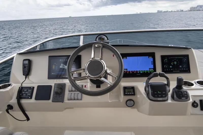 Slide: The Image of Cockpit of 2023 Absolute 62 Fly yacht with modern navigation equipment. - 28