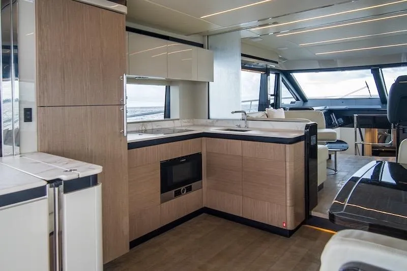 Slide: The Image of Luxurious interior of 2023 Absolute 62 Fly yacht with modern kitchen and panoramic windows. - 34