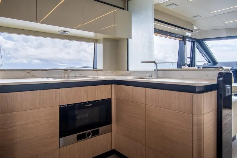 Slide: The Image of Luxurious kitchen interior of 2023 Absolute 62 Fly yacht with modern appliances and ocean view. - 37