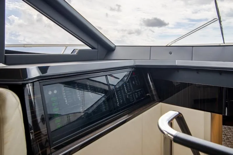Slide: The Image of Interior view of 2023 Absolute 62 Fly yacht cockpit with modern controls. - 41