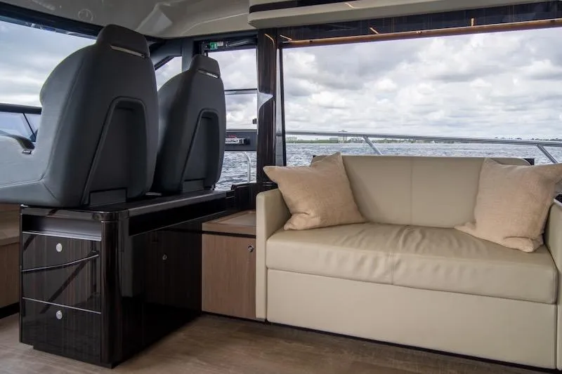 Slide: The Image of Luxurious interior of 2023 Absolute 62 Fly yacht with sofa and helm seats. - 46