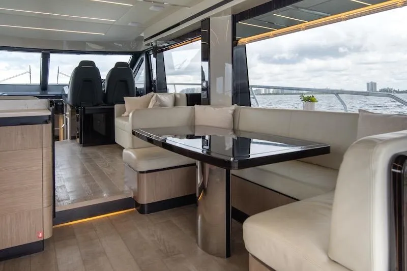 Slide: The Image of Luxurious interior of 2023 Absolute 62 Fly yacht with elegant seating and panoramic windows. - 50