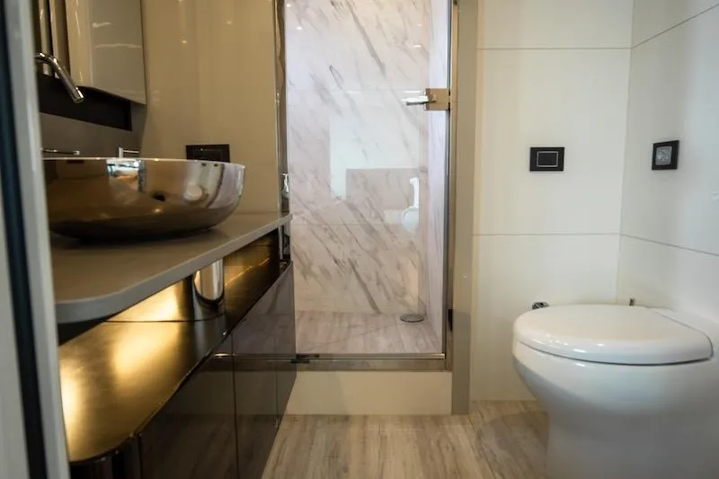 Slide: The Image of Luxurious bathroom in 2023 Absolute 62 Fly yacht with modern fixtures and elegant design. - 60