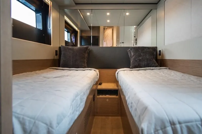 Slide: The Image of Luxurious twin cabin interior of 2023 Absolute 62 Fly yacht, featuring modern design and comfort. - 64