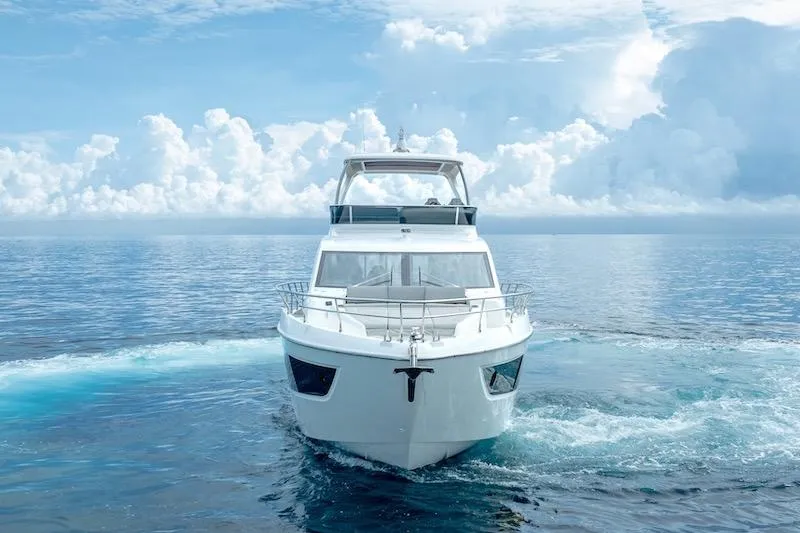 Slide: The Image of 2023 Absolute 62 Fly yacht cruising on open sea under cloudy sky. - 7