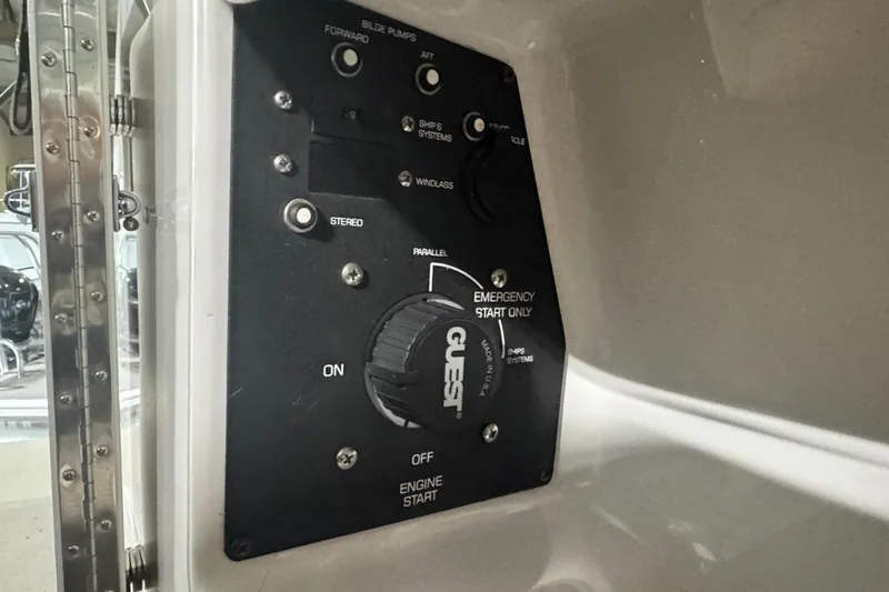 Slide: The Image of Control panel of a 2004 Four Winns 268 Vista boat, featuring various switches and dials. - 20