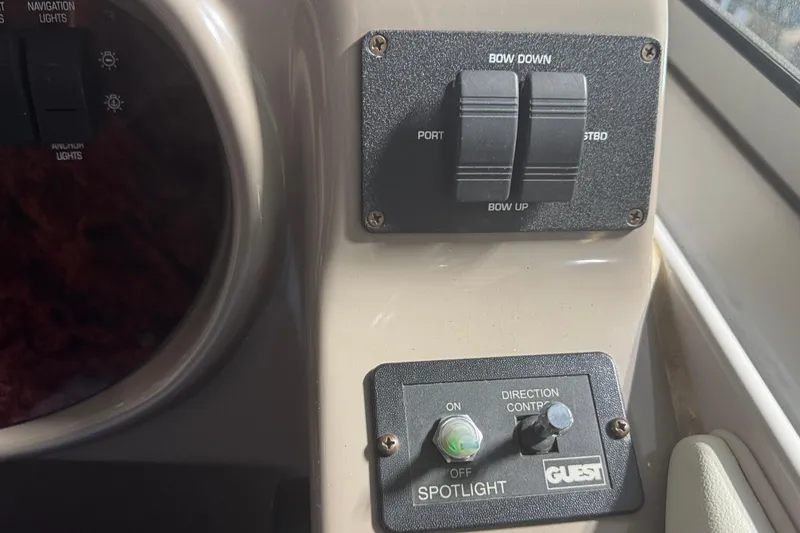 Slide: The Image of Control panel of a 2004 Four Winns 268 Vista boat with spotlight and bow controls. - 21