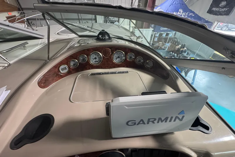 Slide: The Image of 2004 Four Winns 268 Vista boat dashboard with Garmin navigation system. - 6
