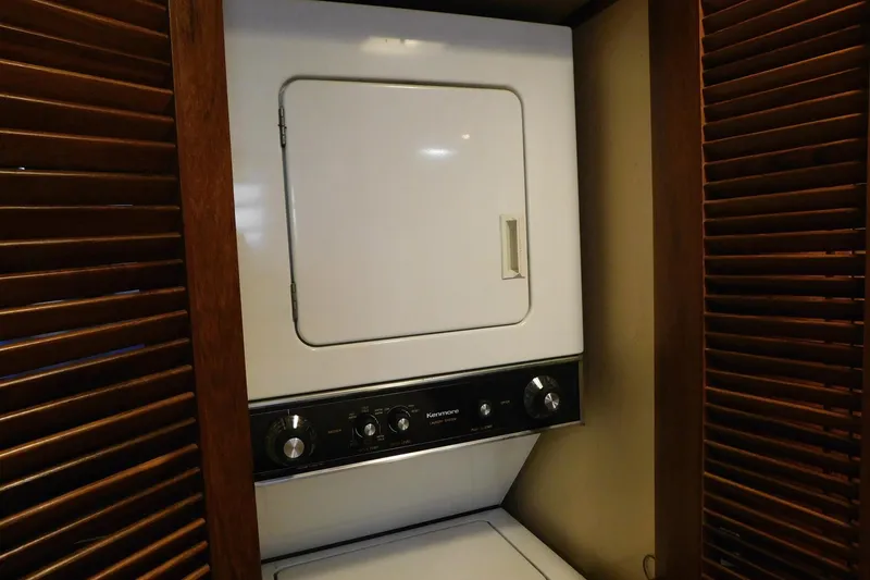 Slide: The Image of Laundry area with a Kenmore dryer inside a 1995 Jefferson 52 Riviana Cockpit MY. - 19