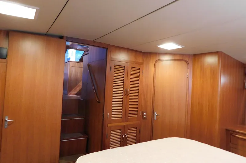 Slide: The Image of Interior of 1995 Jefferson 52 Riviana Cockpit MY with wooden paneling and staircase. - 20