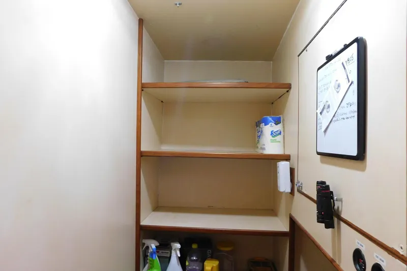 Slide: The Image of Storage shelves in a 1995 Jefferson 52 Riviana Cockpit MY boat interior. - 21