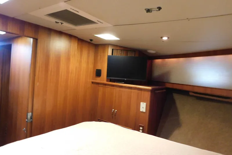 Slide: The Image of Interior of 1995 Jefferson 52 Riviana Cockpit MY with wood paneling and mounted TV. - 22