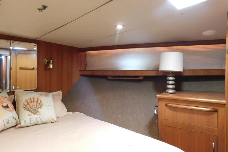 Slide: The Image of Cozy bedroom interior of 1995 Jefferson 52 Riviana Cockpit MY yacht with nautical decor. - 24