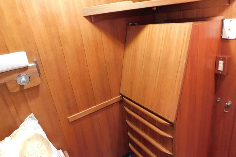 Slide: The Image of Wood-paneled interior of 1995 Jefferson 52 Riviana Cockpit MY with built-in storage. - 27