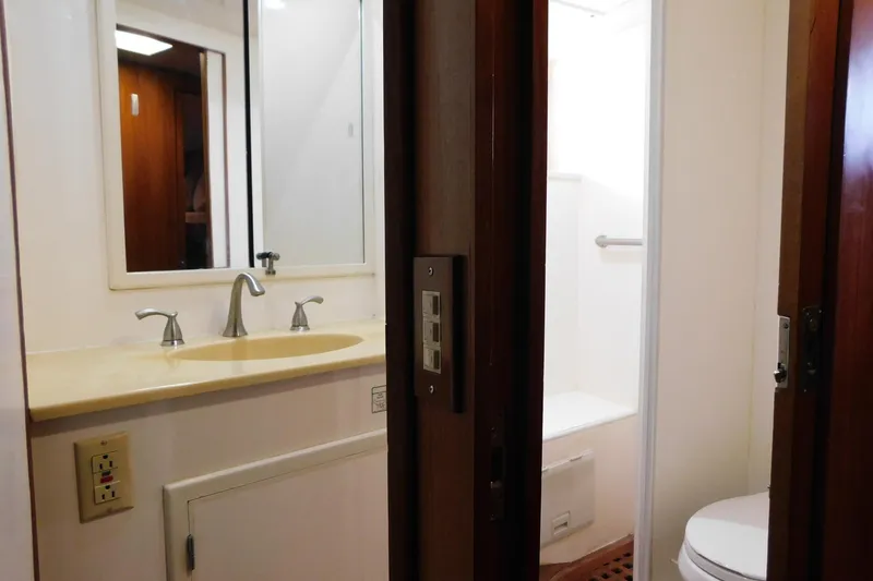 Slide: The Image of Bathroom interior of 1995 Jefferson 52 Riviana Cockpit MY yacht, featuring sink and shower. - 28