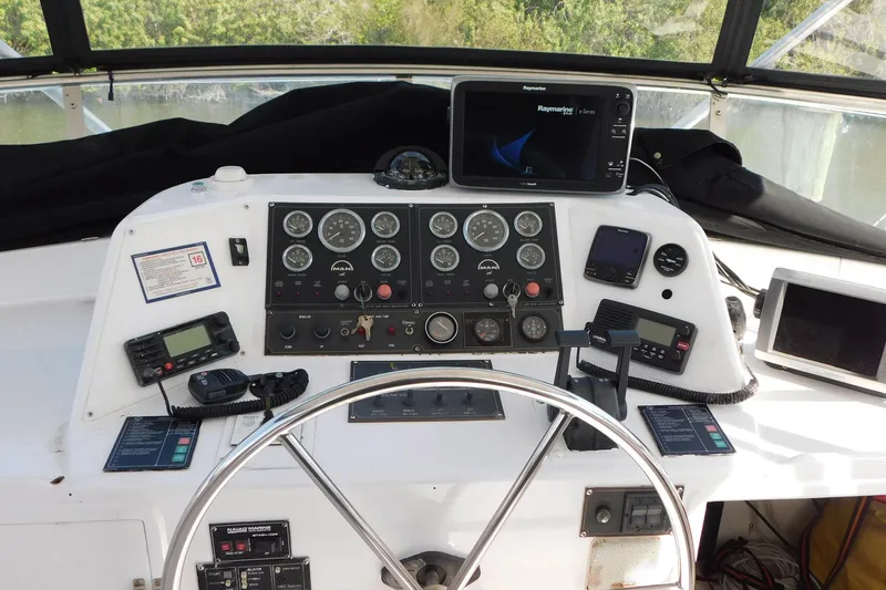 Slide: The Image of Cockpit of 1995 Jefferson 52 Riviana MY with navigation instruments and steering wheel. - 31