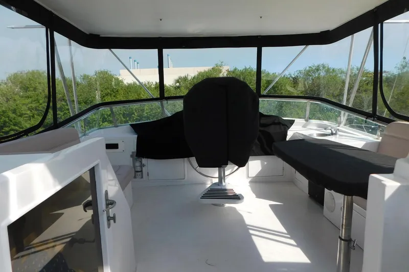 Slide: The Image of 1995 Jefferson 52 Riviana Cockpit MY interior with helm and seating area. - 36
