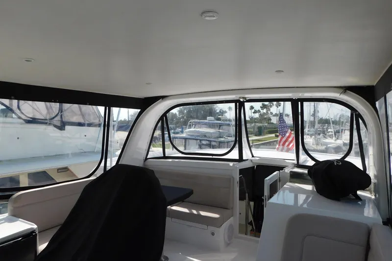 Slide: The Image of Interior view of 1995 Jefferson 52 Riviana Cockpit MY yacht with American flag visible. - 37