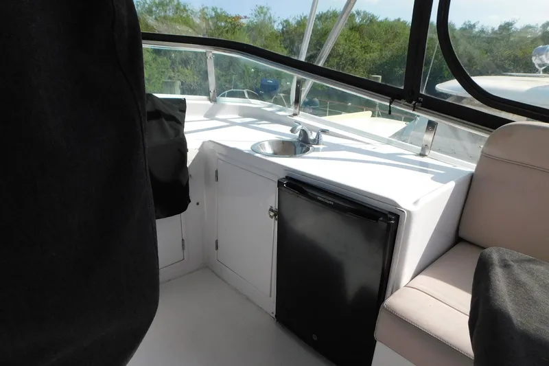 Slide: The Image of 1995 Jefferson 52 Riviana Cockpit MY interior with sink and mini fridge. - 38