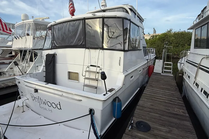 Slide: The Image of 1995 Jefferson 52 Riviana Cockpit MY yacht named Driftwood docked at marina. - 48