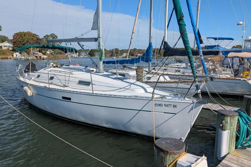 The Image of 2001 Beneteau Oceanis 331 sailboat docked in a marina, clear day. - 0