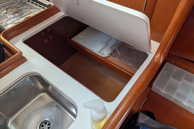 Slide: The Image of Galley area of 2001 Beneteau Oceanis 331 sailboat with sink and storage. - 7
