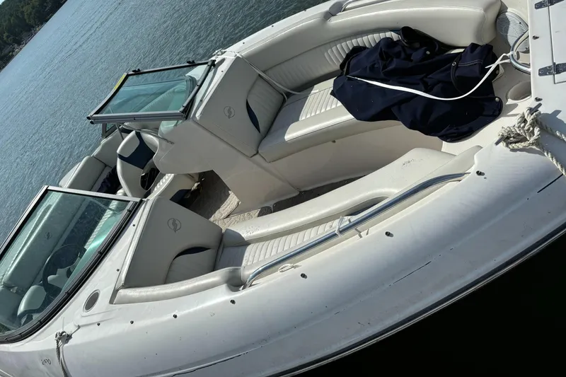 Slide: The Image of 2007 Starcraft 2100 IO RE Limited boat with open seating on calm water. - 3