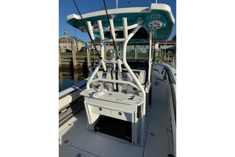 Slide: The Image of 2018 Blackfin 272 CC boat interior with fishing rod holders and seating. - 27
