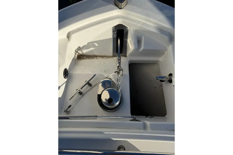 Slide: The Image of 2018 Blackfin 272 CC boat anchor compartment with chain and cleat. - 29
