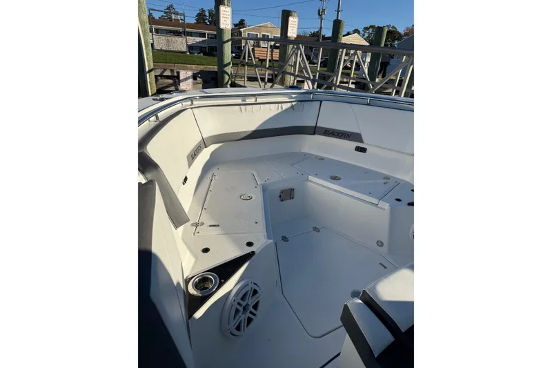 Slide: The Image of 2018 Blackfin 272 CC boat interior with seating and storage compartments. - 30