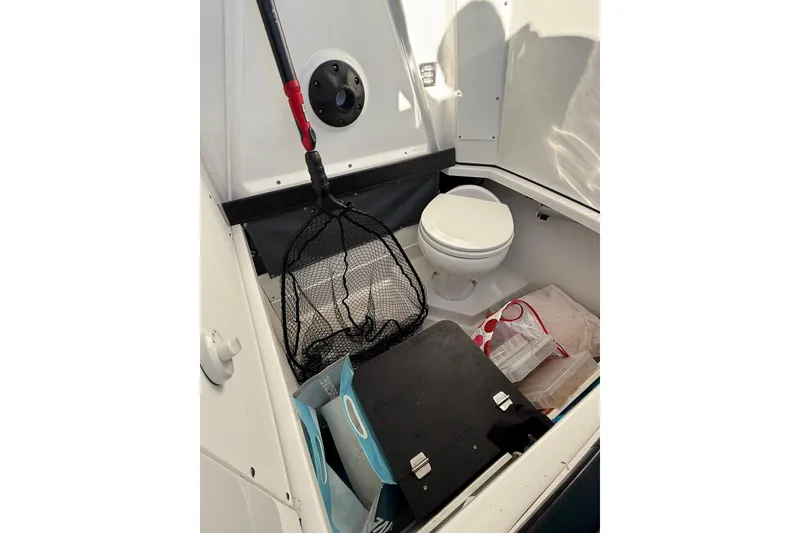 Slide: The Image of Interior of 2018 Blackfin 272 CC boat with toilet and fishing gear. - 31