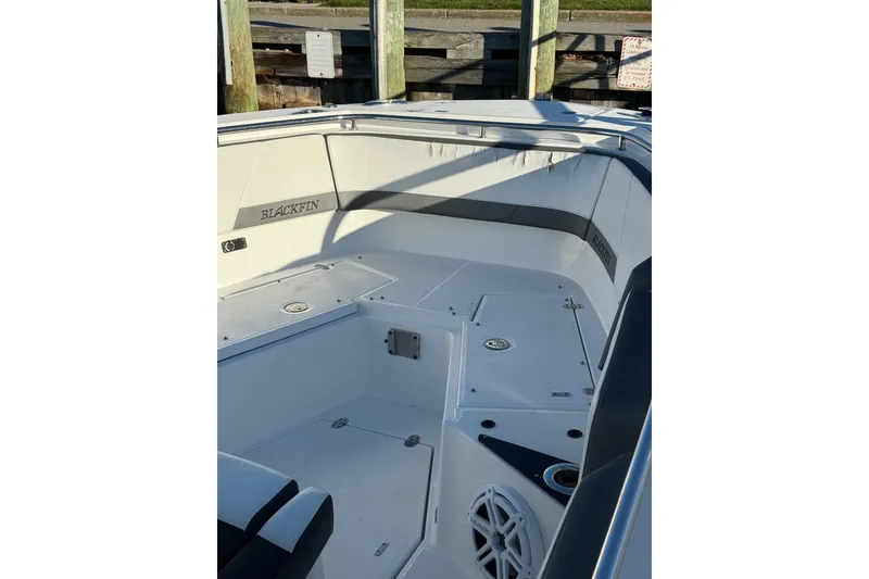 Slide: The Image of 2018 Blackfin 272 CC boat interior with seating and storage compartments. - 33