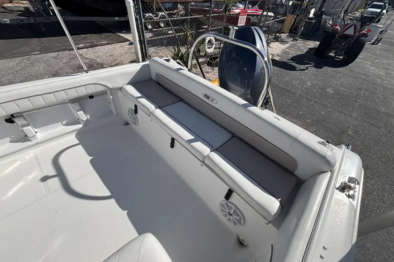 Slide: The Image of 2013 Sea Hunt Escape 188 boat interior with seating and storage. - 8