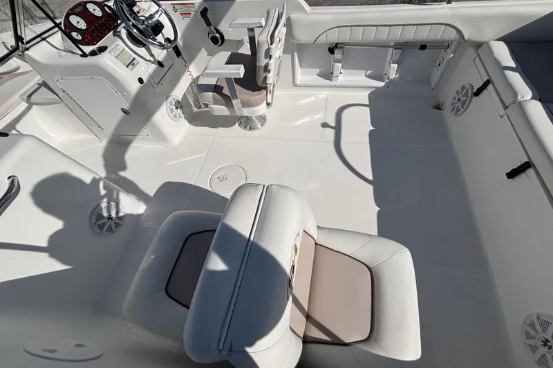 Slide: The Image of 2013 Sea Hunt Escape 188 boat interior with seating and control panel. - 9