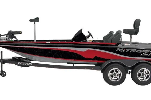 Slide: The Image of 2026 Nitro Z19 XL Pro bass boat with sleek design and dual-axle trailer. - 2