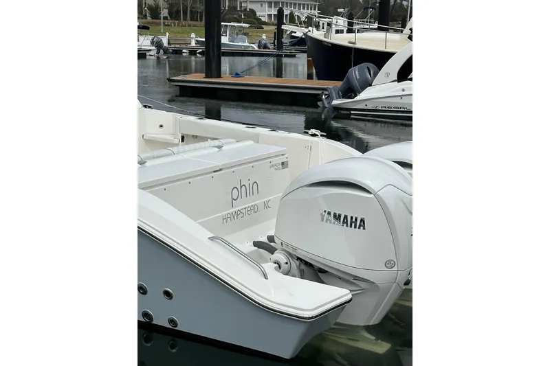 Slide: The Image of 2024 Pursuit OS 325 Offshore boat with Yamaha engine at marina. - 12