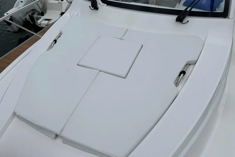 Slide: The Image of 2024 Pursuit OS 325 Offshore boat with cushioned deck area. - 14