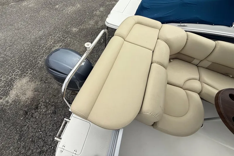 Slide: The Image of 2018 SouthWind V23 L boat with beige seating and outboard motor. - 13