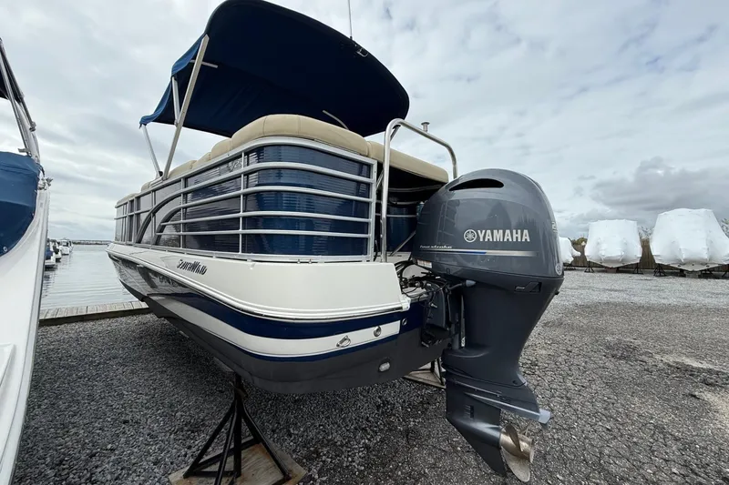 Slide: The Image of 2018 SouthWind V23 L boat with Yamaha outboard motor, docked on gravel. - 4