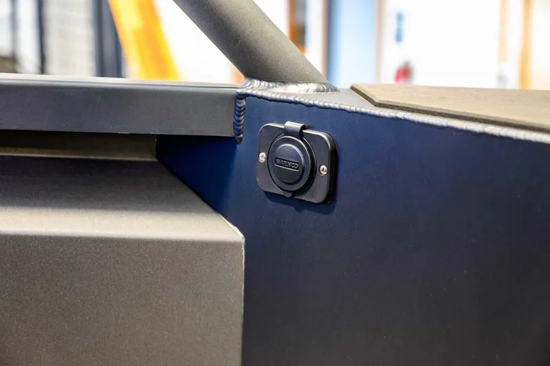 Slide: The Image of 2024 StabiX 240UCC boat detail with a mounted electrical socket. - 13