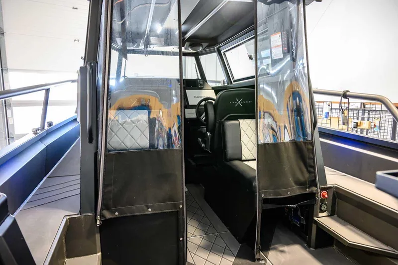 Slide: The Image of 2024 StabiX 240UCC boat interior with modern seating and clear protective covers. - 14