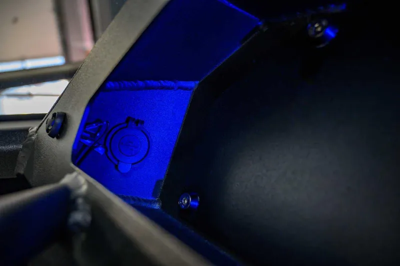 Slide: The Image of Interior view of 2024 StabiX 240UCC with blue lighting and detailed components. - 23