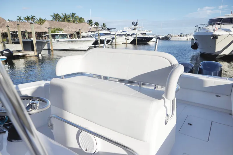 Slide: The Image of 2014 Contender 39 ST boat interior with white seating at marina. - 10