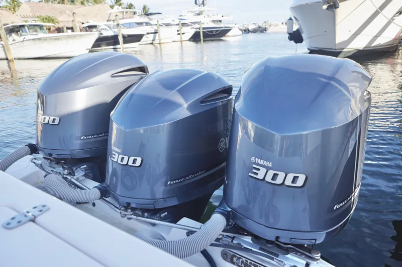 Slide: The Image of Triple Yamaha 300 outboard engines on a 2014 Contender 39 ST boat. - 19