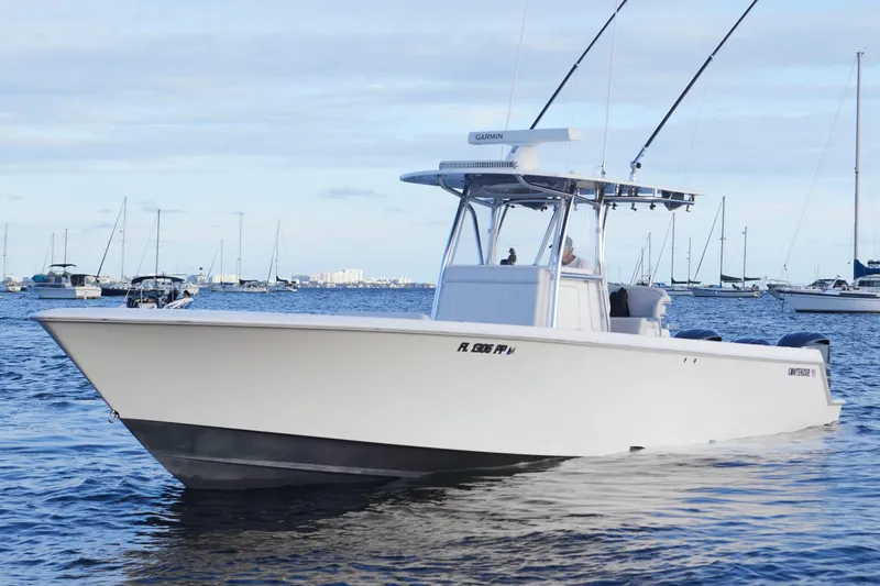 Slide: The Image of 2014 Contender 39 ST boat on calm water with other boats in the background. - 6