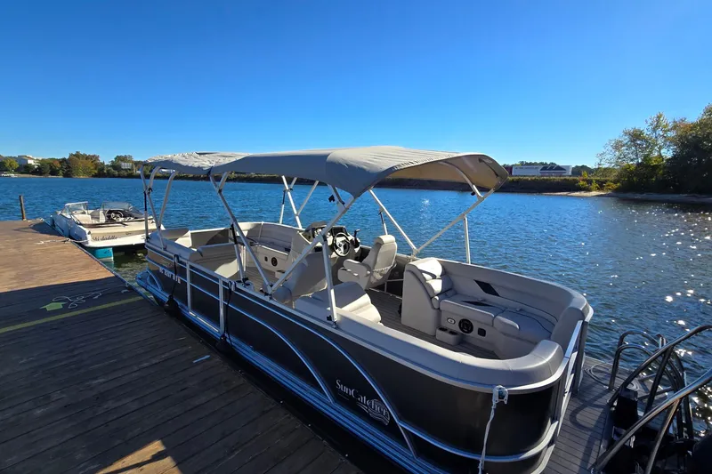 The Image of 2023 G3 Select 22RC pontoon boat docked on a sunny lake. - 0