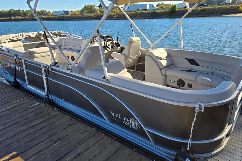 Slide: The Image of 2023 G3 Select 22RC pontoon boat docked on a sunny day by the water. - 1